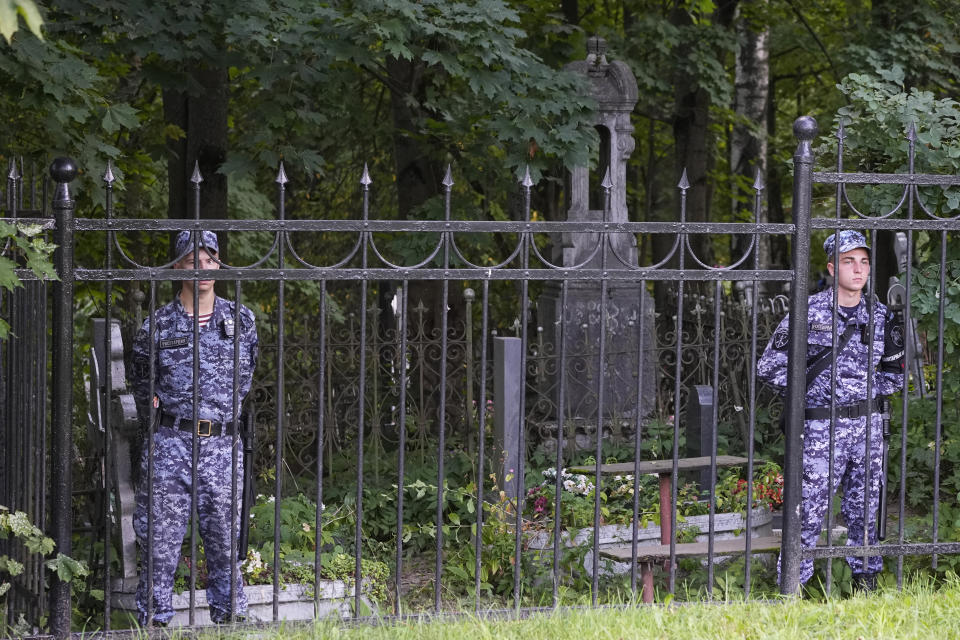 Russian Rosguardia (National Guard) servicemen guard the Porokhovskoye cemetery after a memorial service for mercenary chief Yevgeny Prigozhin, who was killed in a plane crash last week, in St. Petersburg, Russia, Tuesday, Aug. 29, 2023. Spokespeople for Wagner chief Yevgeny Prigozhin say a memorial service for the mercenary boss took place behind closed doors. A terse statement on social media said Tuesday that "those who wish to bid their farewell" to the 62-year-old head of the Wagner private military contractor should go to the Porokhovskoye cemetery in St. Petersburg, his hometown. (AP Photo/Dmitri Lovetsky)