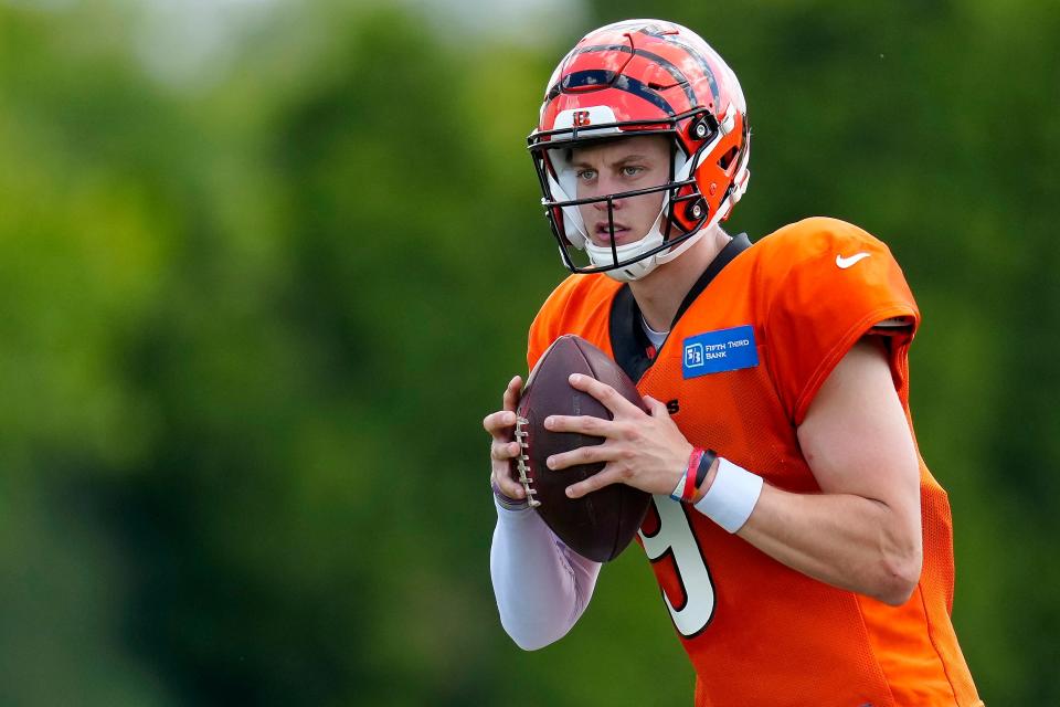 Cincinnati Bengals quarterback Joe Burrow (9) drops back to throw during a training camp practice at the Paycor Stadium practice fields in downtown Cincinnati on Wednesday, Aug. 17, 2022.