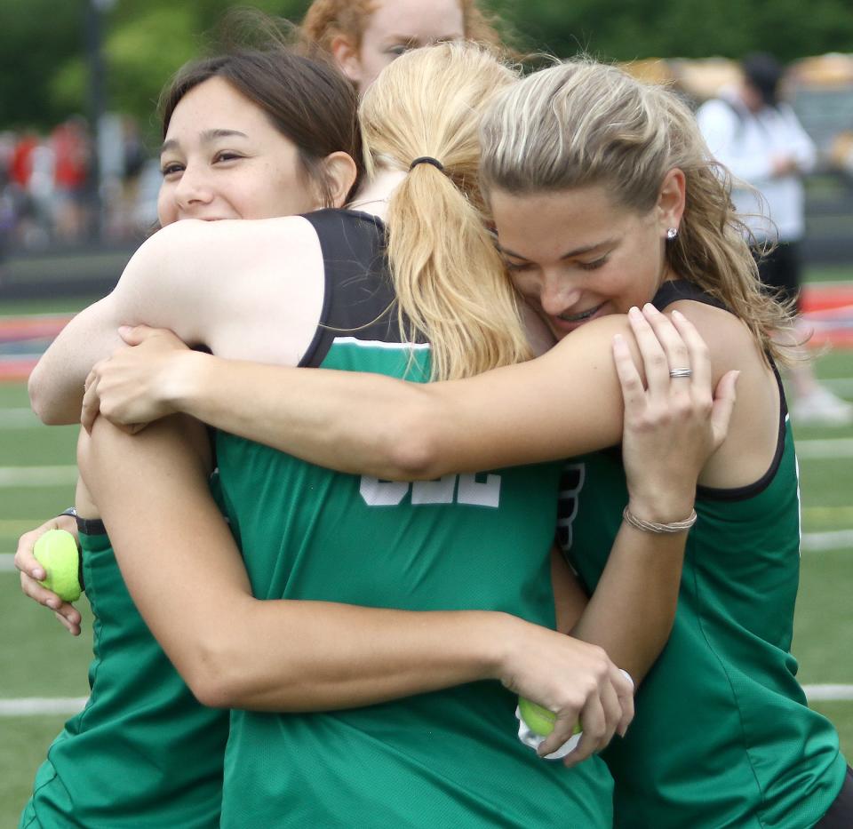 West Branch's (from left) Lauren Gossett, Zoe Sanders and Kennedy Berger celebrate after their state qualifying place in the girls 4x100 meter relay final at the Division II track and field regional finals held at Austintown Fitch High School, Saturday, May 28, 2022.