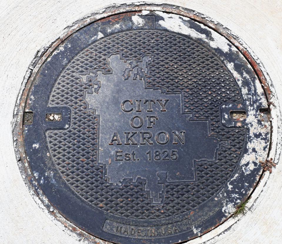 A city of Akron hole cover is seen near the Headworks building at the Akron Water Reclamation Facility