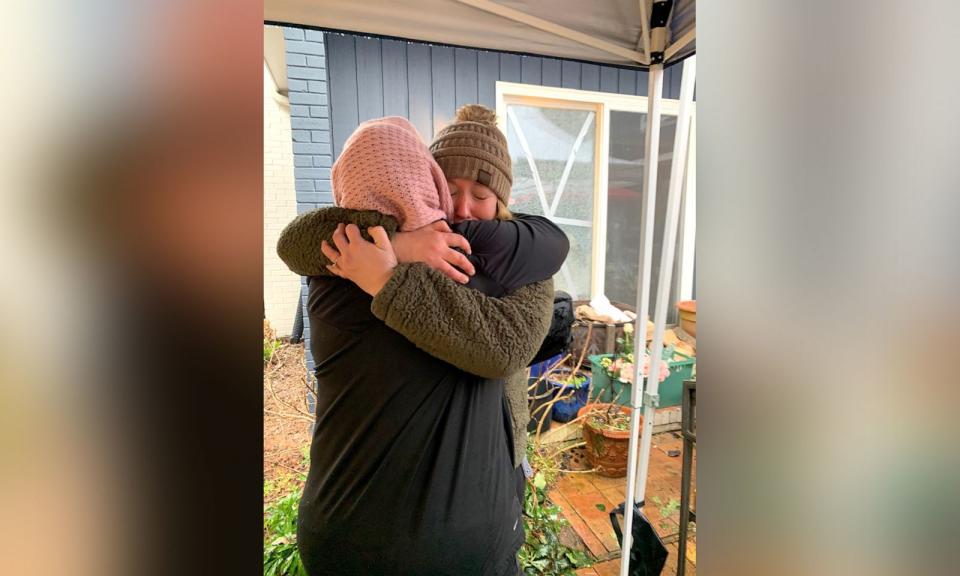 PHOTO: Ashley Manning hugs a recipient of one of her Valentine's Day floral arrangements on Feb. 14, 2021.  (Ashley Manning )