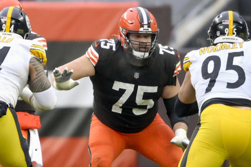 FILE - Cleveland Browns offensive guard Joel Bitonio (75) blocks in the third quarter an NFL football game against the Pittsburgh Steelers in Cleveland, in this Sunday, Jan. 3, 2021, file photo. Browns Pro Bowl left guard Joel Bitonio will be activated from the COVID-19 list Friday, Jan. 15, 2021, after missing last week’s playoff win over Pittsburgh. (AP Photo/David Richard, File)