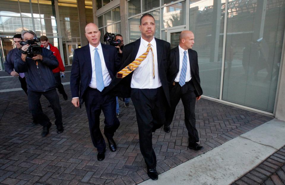 State Rep. Clayton Luckie, center, with FBI Special Agent Jeff Williams, left, on the way to jail after Luckie turned himself in at the FBI office on October 10, 2012. (Columbus Dispatch photo by Tom Dodge)
(Credit: Tom Dodge, THE COLUMBUS DISPATCH)