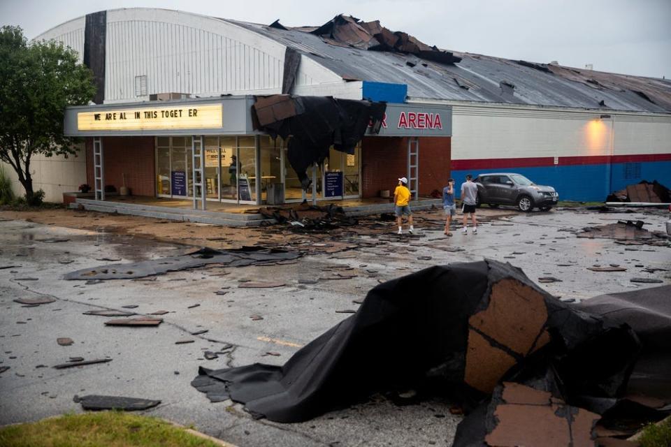 Pieces of the Buccaneer Arena roof litter the parking lot after a strong thunderstorm with high winds blew through the Des Moines metro area on Monday, Aug. 10. 2020, in Urbandale, Iowa.