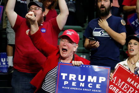 Supporters of Republican presidential nominee Donald Trump cheer during a campaign rally in Everett, Washington, U.S., August 30, 2016. REUTERS/Carlo Allegri