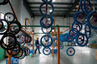 An employee works on the production line of Kent bicycles at Shanghai General Sports Co., Ltd, in Kunshan, Jiangsu Province, China, February 22, 2019. Picture taken February 22, 2019. REUTERS/Aly Song