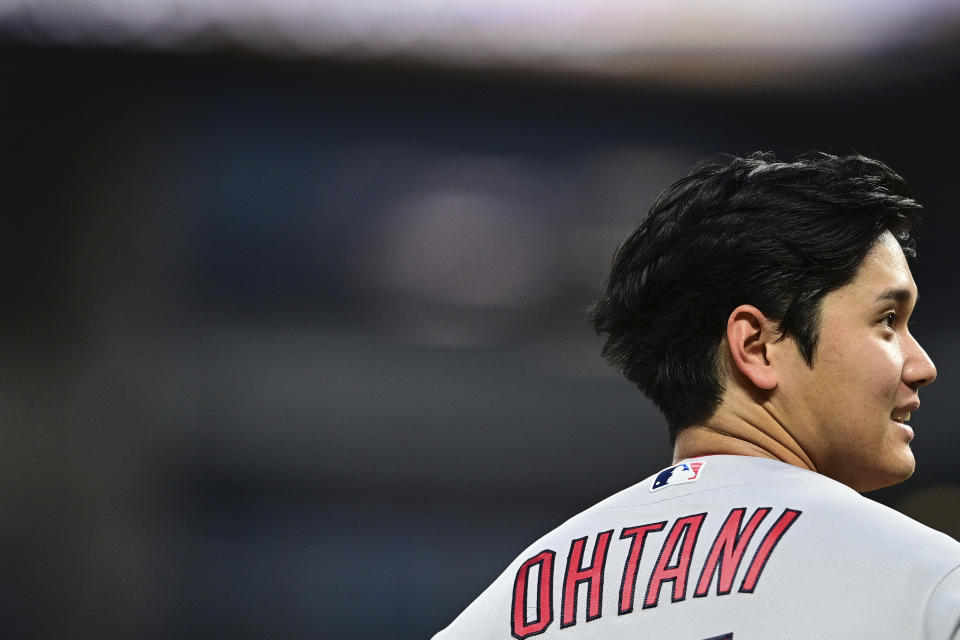 Los Angeles Angels' Shohei Ohtani stands on third base during a pitching change in the fifth inning of the team's baseball game against the Cleveland Guardians, Friday, May 12, 2023, in Cleveland. (AP Photo/David Dermer)