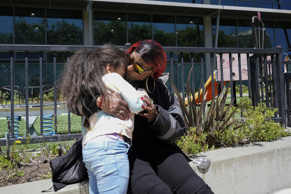 Teniah Tercero kisses her daughter Valentina, 4, while spending time at a park Thursday, May 23, 2024, in San Francisco. (AP Photo/Godofredo A. Vásquez)