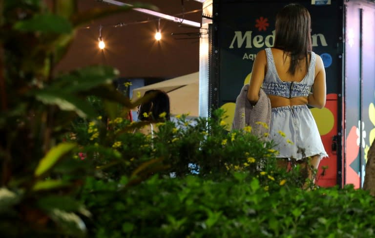 A woman walks in Lleras park in Medellin -- the city expects a record number of visitors this year (STR)