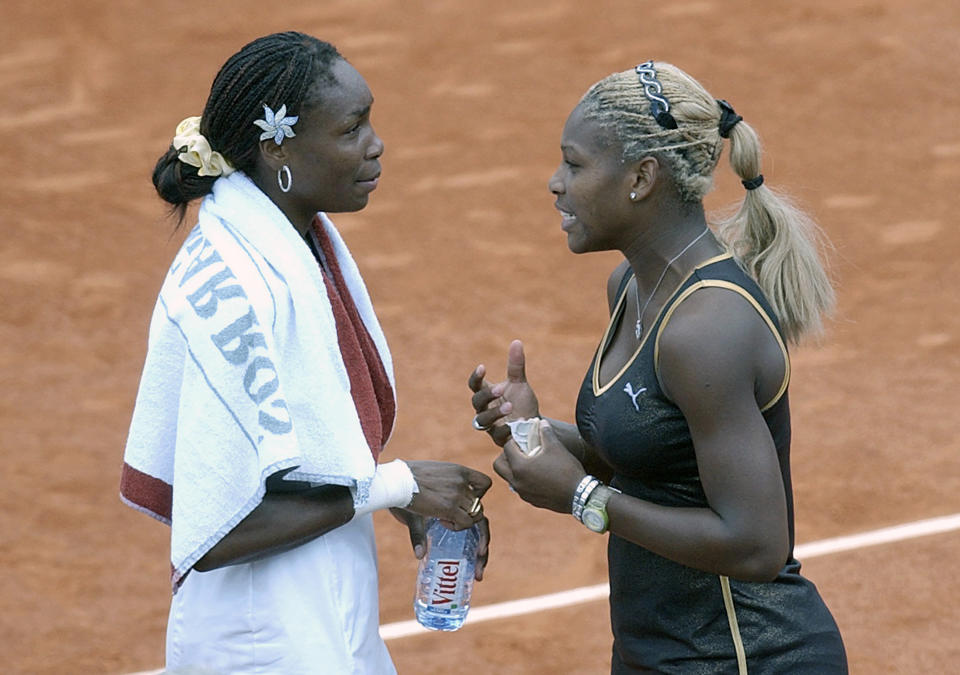 FILE - In this June 8, 2002, file photo, Serena Williams, right, talks with her sister Venus after Serena won the women's final of the French Open tennis tournament at Roland Garros stadium in Paris. Serena Williams defeated her sister Venus 7-5, 6-3. Williams has only won two clay-court matches over the past two years and says her lack of competition on the surface makes her uncomfortable ahead of the French Open. The tournament begins Sunday in Paris. (AP Photo/Christophe Ena, File)