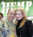 FILE - In this Thursday, Feb. 18, 2010, file photo, actor-comedian Cheech Marin joins Cheryl Shuman, executive director of NORML90210, the Beverly Hills chapter of the National Organization for the Reform of Marijuana Laws, as they appear at a news conference to launch a partnership with HempCon.com and Medical Marijuana Show, at the Los Angeles Convention Center. Country singer Willie Nelson, the children of the late reggae icon Bob Marley and comedian Whoopi Goldberg are just a few of the growing number of celebrities publicly jumping into the marijuana industry and eyeing the California pot market. (AP Photo/Reed Saxon, File)