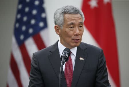 Singapore's Prime Minister Lee Hsien Loong gives a joint statement with U.S. President Donald Trump in the Rose Garden of the White House in Washington, U.S., October 23, 2017. REUTERS/Joshua Roberts