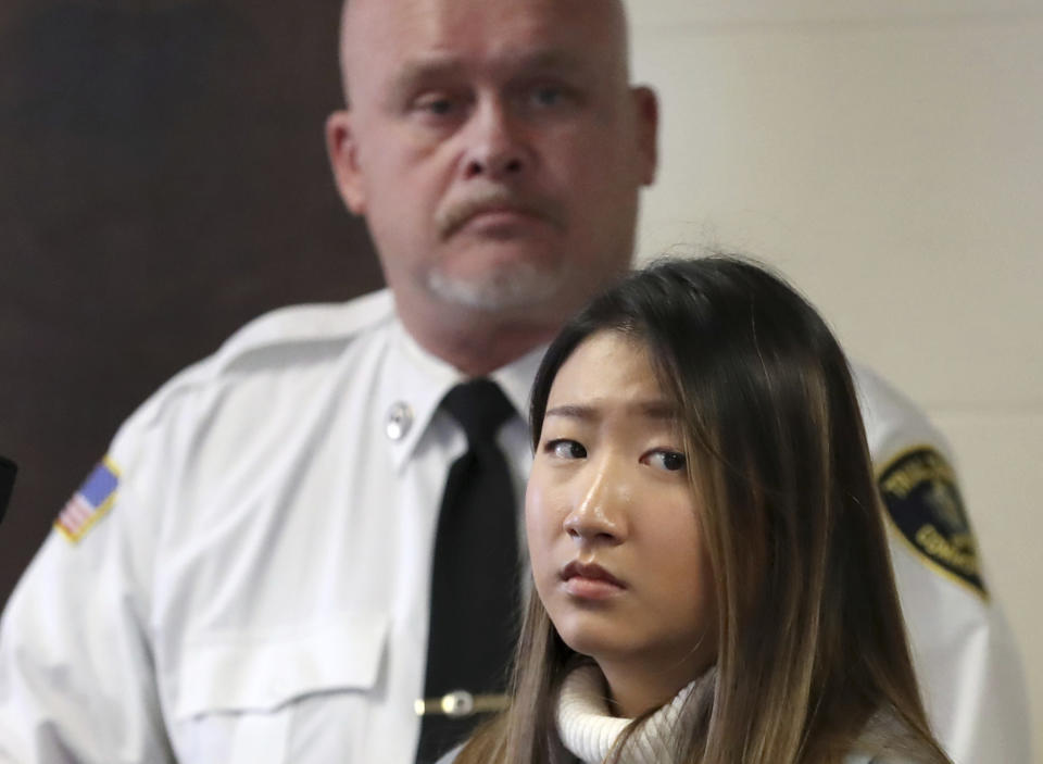 Inyoung You, 21, appears in Suffolk Superior Court, Friday, Nov. 22, 2019, in Boston. The former Boston College student pleaded not guilty to involuntary manslaughter in a case accusing her of encouraging her boyfriend Alexander Urtula to take his life. Prosecutors say she sent Urtula more than 47,000 text messages in the last two months of the relationship, including many urging him to “go kill yourself.” (David L Ryan/The Boston Globe via AP, Pool)