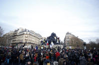 People march during a demonstration Tuesday, Dec. 10, 2019 in Paris. French airport employees, teachers and other workers joined nationwide strikes Tuesday as unions cranked up pressure on the government to scrap upcoming changes to the country's national retirement system. (AP Photo/Thibault Camus)