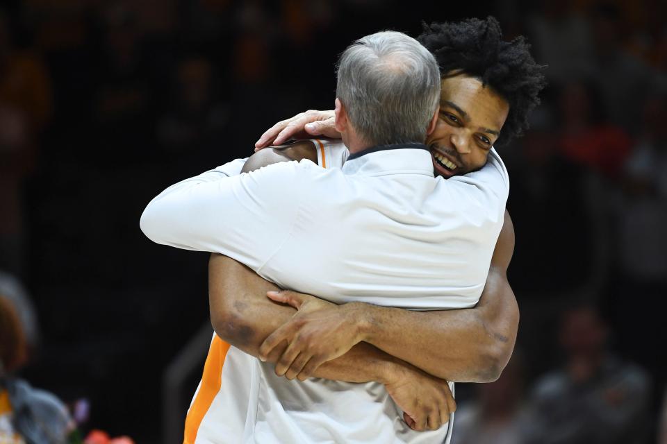 Tennessee's Josiah-Jordan James (30) and Rick Barnes hug during the senior night ceremonies before the start of the NCAA college basketball game against Arkansas on Tuesday, February 28, 2023 in Knoxville, Tenn.