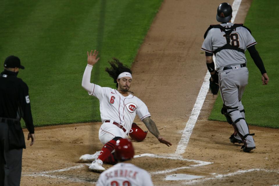 Cincinnati Reds second baseman Jonathan India scores during a April 20, 2021 game.