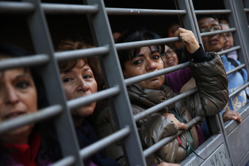 Melchorita Garcia cries as she watches how Jose Antonio Giraldo Zacarias is told that his eviction has been temporarily suspended in Madrid