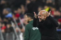 Manchester City's head coach Pep Guardiola reacts during the Champions League quarter finals second leg soccer match between Bayern Munich and Manchester City, at the Allianz Arena stadium in Munich, Germany, Wednesday, April 19, 2023. (AP Photo/Andreas Schaad)
