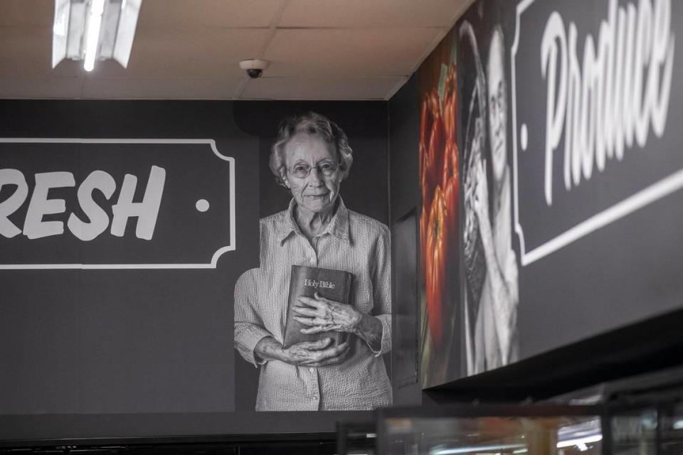 A photograph of the late Hope Campbell, a former area resident, taken by local photographer Malcolm Wilson, is displayed on a photo banner in Isom IGA in Isom, Ky.