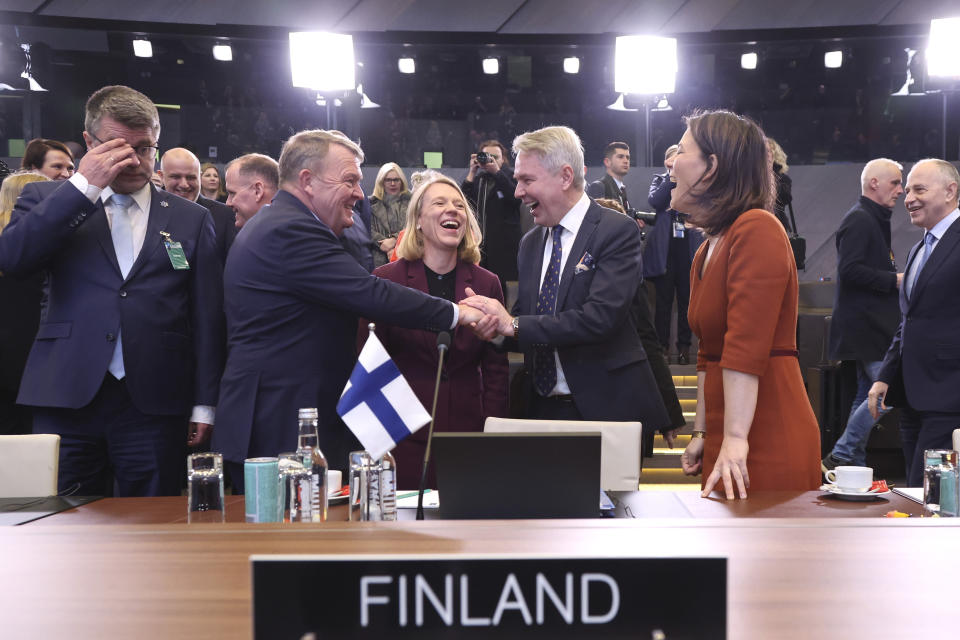 Denmark's Foreign Minister Lars Lokke Rasmussen, center left, shakes hands with Finland's Foreign Minister Pekka Haavisto as they attend the NATO-Ukraine Commission during a meeting of NATO foreign ministers at NATO headquarters in Brussels, Tuesday, April 4, 2023. At center is Norway's Foreign Minister Anniken Huitfeldt, and center right is Germany's Foreign Minister Annalena Baerbock. (AP Photo/Geert Vanden Wijngaert)