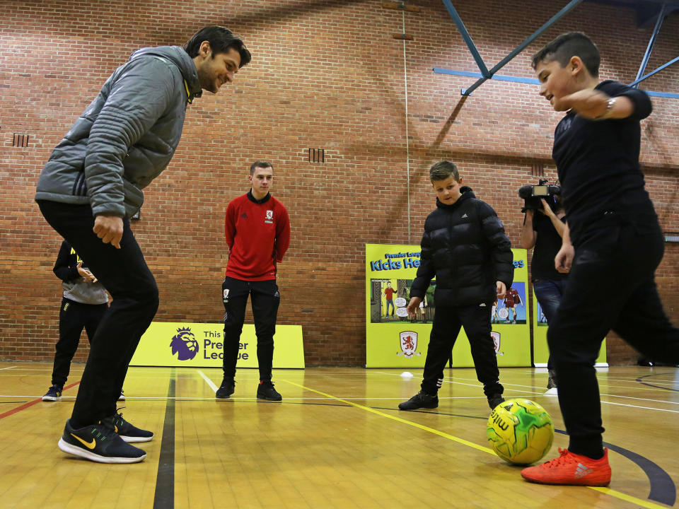 Youngsters from Middlesbrough take part in a session with defender George Friend: Getty