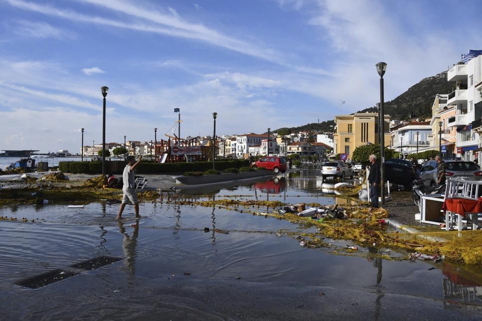 Seawater covers a road after an earthquake at the port of Vathi on the eastern Aegean island of Samos, Greece, Friday, Oct. 30, 2020. A strong earthquake struck in the Aegean Sea between the Turkish coast and the Greek island of Samos as the magnitude 6.6 earthquake was centered in the Aegean at a depth of 16.5 kilometers, or 10.3 miles.(AP Photo/Michael Svarnias)