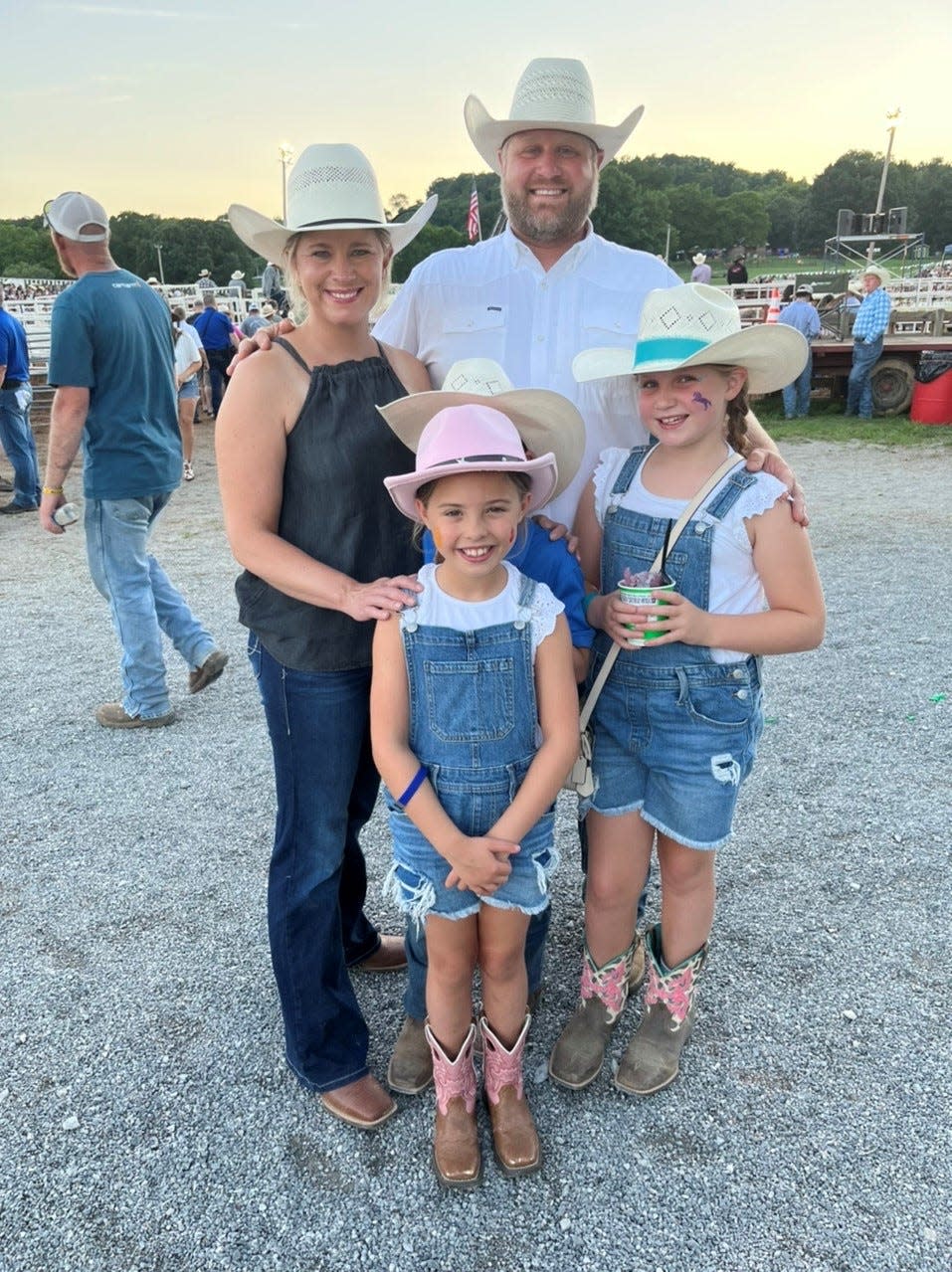 Trevor and Haverly Pennington enjoy the rodeo with their children Baeu, 7, Hattie Anne, 8, and friend Collie Schmidt, 7, at Maury County Park on July 15, 2023 in Columbia, Tenn.