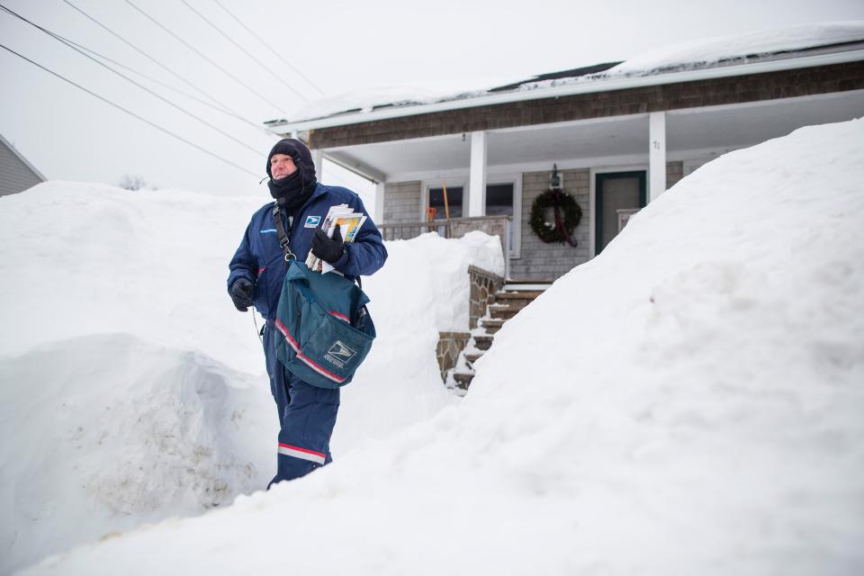 A United States Postal Service worker in Hull, Massachusetts, February 21, 2015.