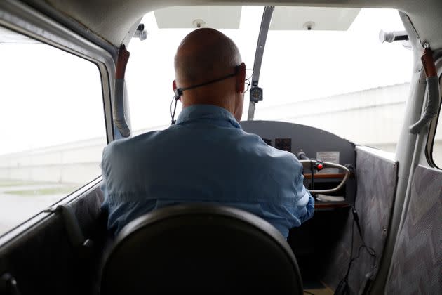 Carl Eisen, a former airline pilot, does a preflight and maintenance check on his antique airplane before flying out of the Punta Gorda Airport in Punta Gorda, Florida, in June. In 2016, Eisen created Mindful Aviator, an online course that uses meditation to help pilots handle anxiety. (Photo: Octavio Jones for HuffPost)