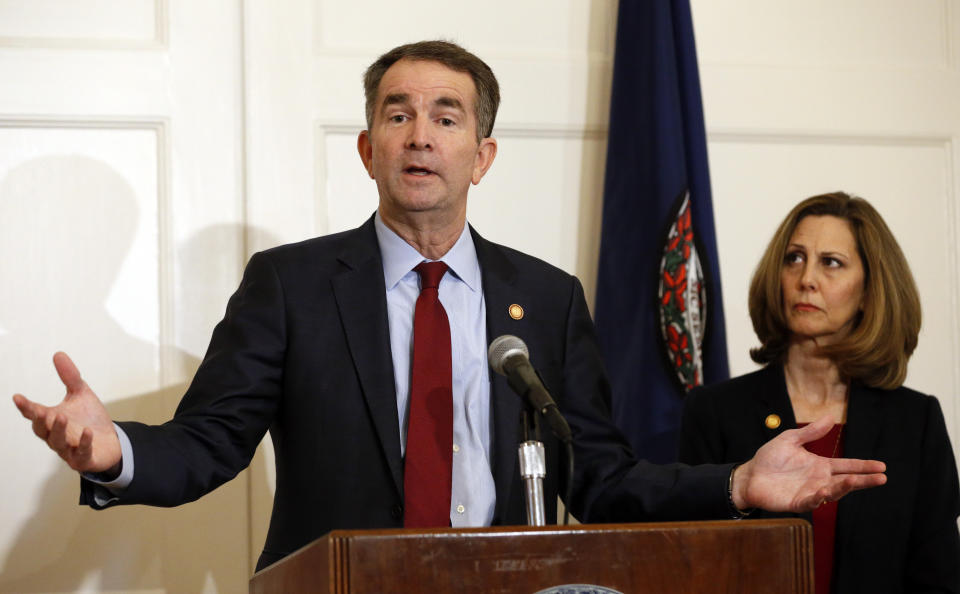In this Feb. 2, 2019, photo, Virginia Gov. Ralph Northam, left, accompanied by his wife, Pam, speaks during a news conference in the governor's mansion in Richmond, Va. Democrats are hoping there’s a silver lining to the Northam mess - that it shows they won’t tolerate racism. Every level of the party has condemned the Democratic Virginia governor and demanded he step down. That follows disclosure that his medical school yearbook page features photos of a man in blackface standing with someone dressed in Klu Klux Klan attire.(AP Photo/Steve Helber)