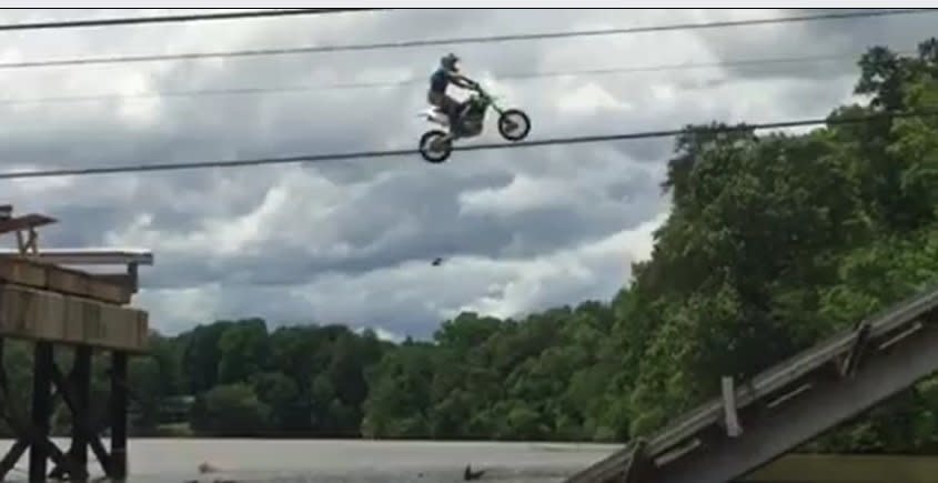 A dirt biker jumping the 72 foot gap. (Photo: <a href="https://www.facebook.com/colt45howell/videos/10212036661499274/" target="_blank">Facebook</a>)