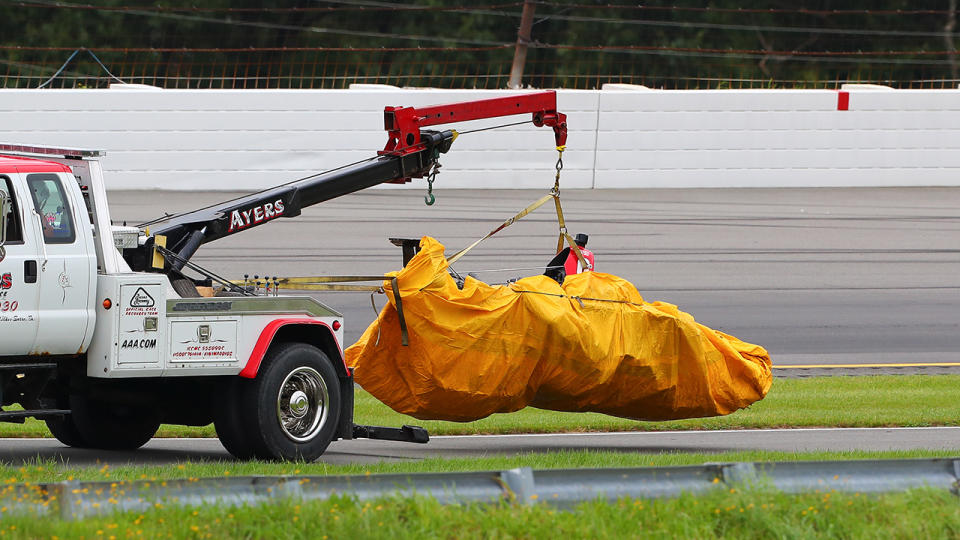 The car of Schmidt Peterson Motorsports driver Robert Wickens (6) of Canada is bagged up and towed into the garage area after an accident during the IndyCar Series at Pocono Raceway. (Photo by Rich Graessle/Icon Sportswire via Getty Images)