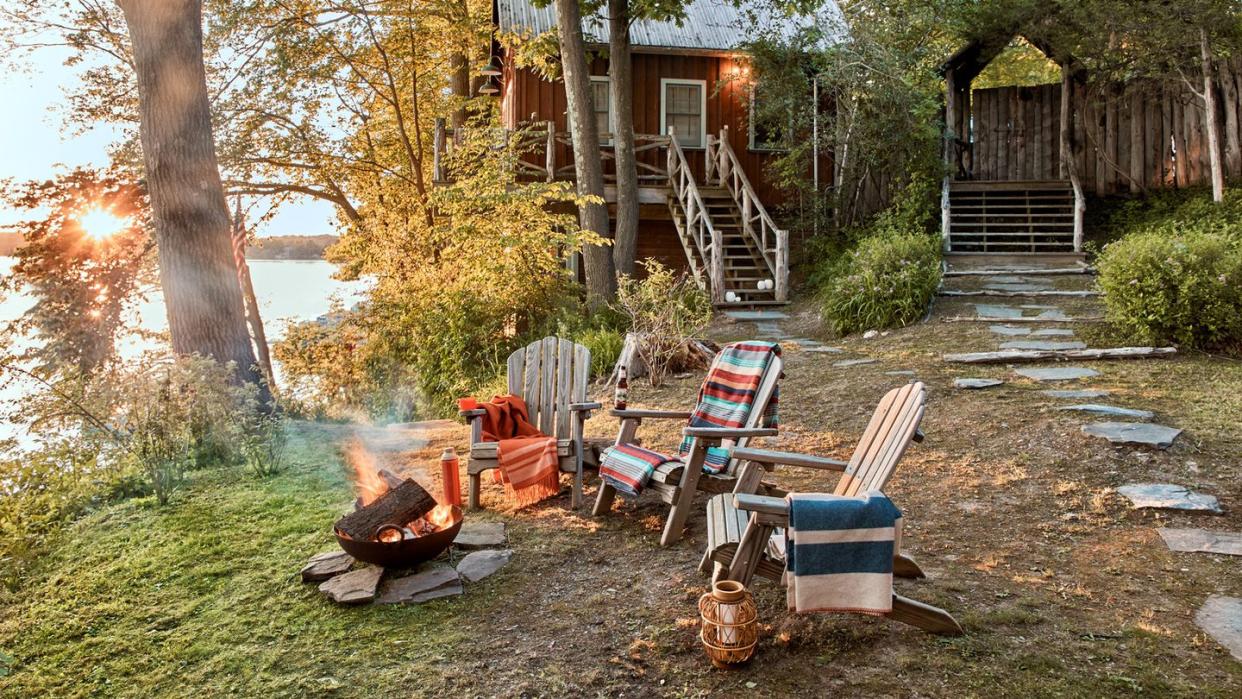 vacation home of vincent mazeau and natasha mazeau in new york’s copake lake exterior with campfire