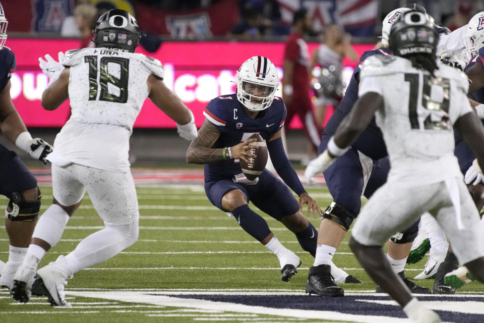 Oregon wide receiver Seven McGee (7) runs the ball against Oregon during the first half of an NCAA college football game Saturday, Oct. 8, 2022, in Tucson, Ariz. (AP Photo/Rick Scuteri)