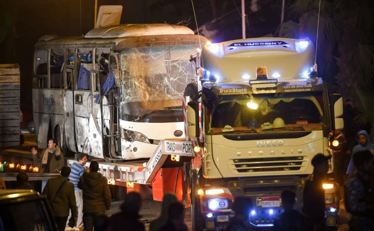 This picture taken on December 28, 2018 shows a tourist bus which was hit by a deadly bombing being towed away from the scene in Giza province south of the Egyptian capital Cairo