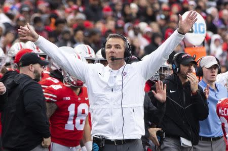 Nov 24, 2018; Columbus, OH, USA; Ohio State Buckeyes head coach Urban Meyer tries to get the attention of the referee against the Michigan Wolverines at Ohio Stadium. Mandatory Credit: Greg Bartram-USA TODAY Sports