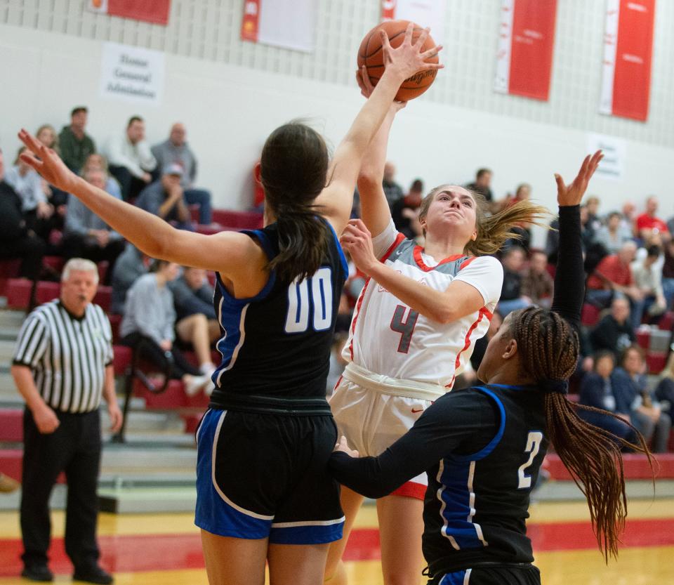 Northwest's AshlynStark attempts a shot in the first half with pressure friom CVCA's Katelyn Harabedian,left, and Joi Williams at Northwest. Wednesday, January 4, 2023.