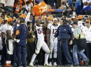 Denver Broncos' Von Miller holds a cooler over his head after dousing Broncos' head coach Gary Kubiak with sports drink in the fourth quarter during the NFL's Super Bowl 50 against the Carolina Panthers in Santa Clara, California February 7, 2016. REUTERS/Lucy Nicholson