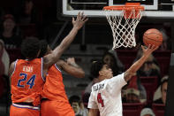 San Diego State guard Trey Pulliam (4) shoots against Boise State forward Abu Kigab (24) and guard Devonaire Doutrive, second from left, during the second half of an NCAA college basketball game Saturday, Feb 27, 2021, in San Diego. (AP Photo/Gregory Bull)