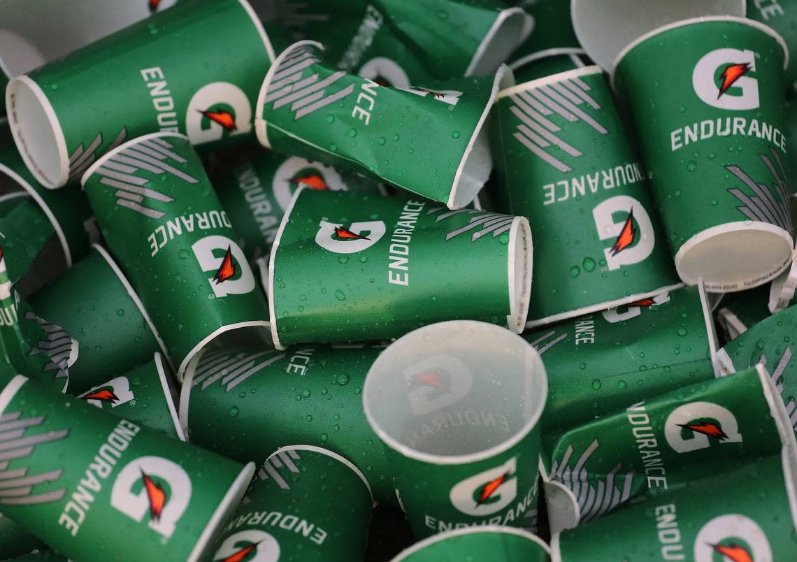 Discard paper cups are neatly piled on the Ocean Drive. On Sunday, January 27, 2018 under dark skies thousands of athletes - pushrim, handcycle, and assisted wheelchair, elite, and daily runners participated in the 2019 Fitbit Miami Marathon and Half Marathon produced by Life Time. The full course spanned across the Venetian, Rickenbacker, and MacArthur Causeways ending at Bayfront Park in downtown Miami, Florida.