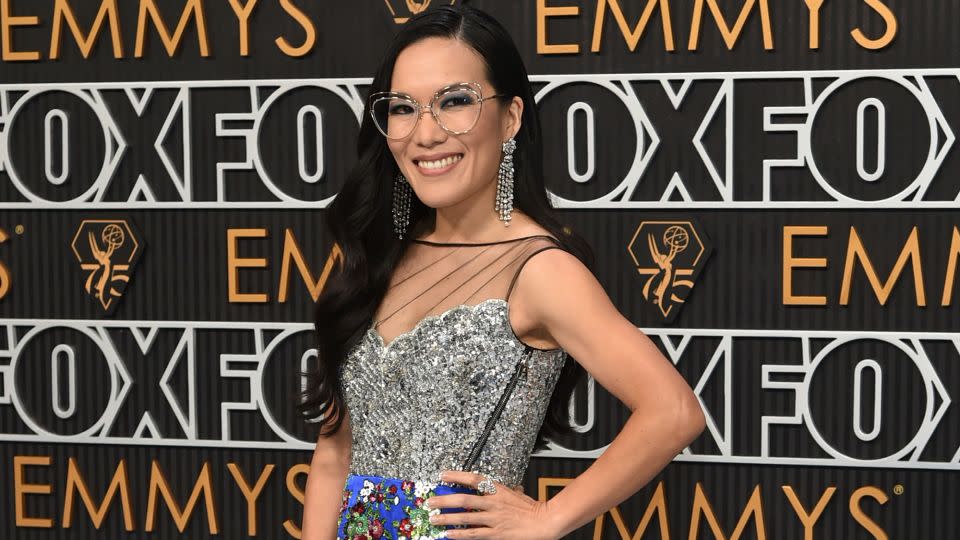 “Beef” actor and co-producer Ali Wong was a kaleidoscope of color in a custom Louis Vuitton outfit comprising a top with silver sequined bodice and blue embroidered floral satin skirt. - Richard Shotwell/Invision/AP