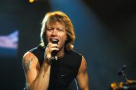 <p>Jon Bon Jovi said farewell to his feathered bangs and curly hair in the early '90s, but the rockstar continued to slay on stage with shoulder length, sandy blonde hair. </p>