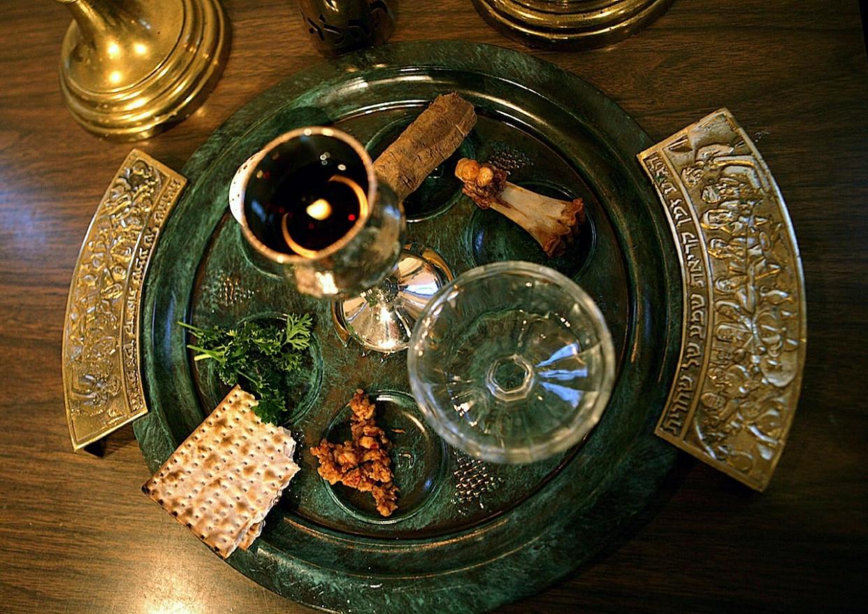 Seder plate features roasted egg, maror, roasted chicken neck, charoset, vegetables followed by a second bitter vegetable. (The Associated Press - image credit)