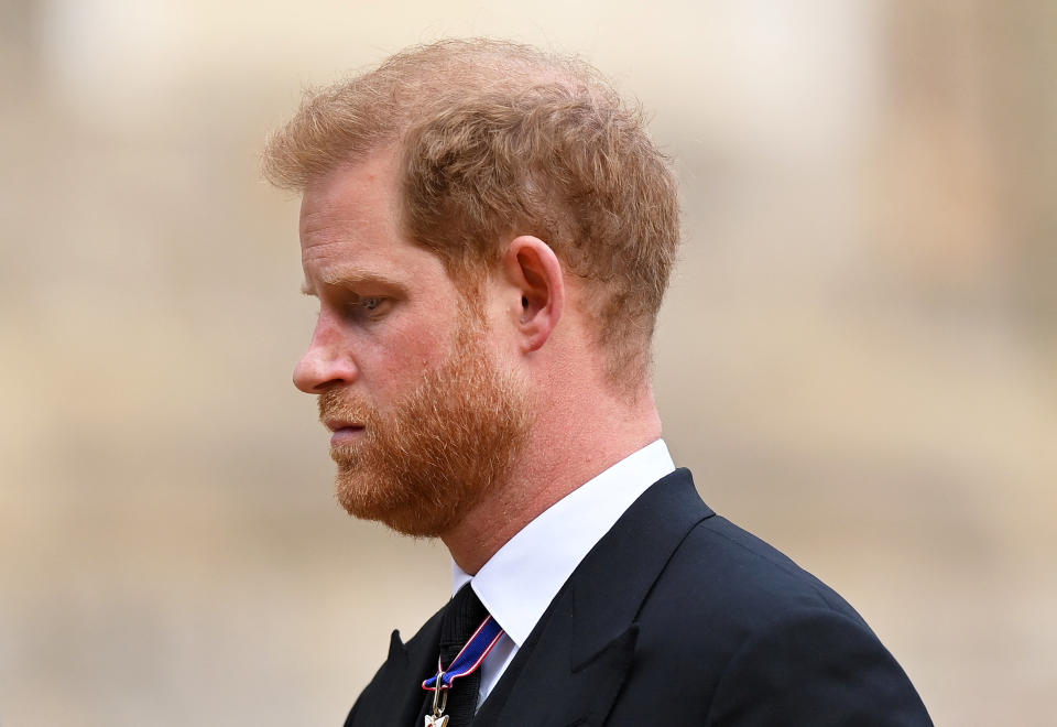 WINDSOR, ENGLAND - SEPTEMBER 19:  Prince Harry, Duke of Sussex as he joined the Procession following the State Hearse carrying the coffin of Queen Elizabeth II towards St George's Chapel on September 19, 2022 in Windsor, England. The committal service at St George's Chapel, Windsor Castle, took place following the state funeral at Westminster Abbey. A private burial in The King George VI Memorial Chapel followed. Queen Elizabeth II died at Balmoral Castle in Scotland on September 8, 2022, and is succeeded by her eldest son, King Charles III.     Justin Setterfield/Pool via REUTERS