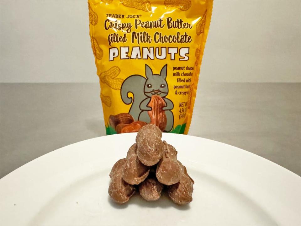 Yellow bag with a squirrel graphic of Trader Joe's crispy peanut-butter-filled milk-chocolate peanuts