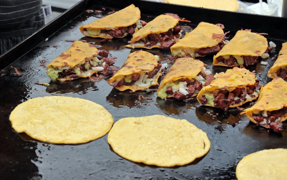 Tacos sizzle on a flat top at VZD's carne asada taco competition on June 3, 2023 in Oklahoma City, Okla. [Steve Sisney/For The Oklahoman]