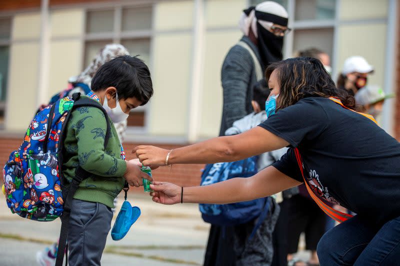 FILE PHOTO: Students arrive for the first time since the start of the COVID-19 pandemic in Scarborough