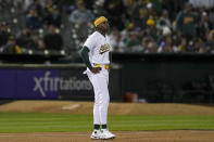 Oakland Athletics' Lawrence Butler reacts after being tagged out at third base on a throw by Cleveland Guardians right fielder Ramón Laureano during the fifth inning of a baseball game Thursday, March 28, 2024, in Oakland, Calif. (AP Photo/Godofredo A. Vásquez)