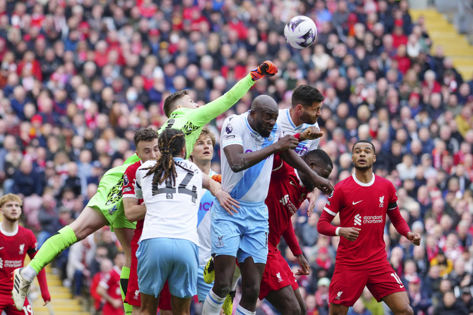 Crystal Palace's goalkeeper Dean Henderson punches the ball away during the English Premier League soccer match between Liverpool and Crystal Palace at Anfield Stadium in Liverpool, England, Sunday, April 14, 2024. (AP Photo/Jon Super)