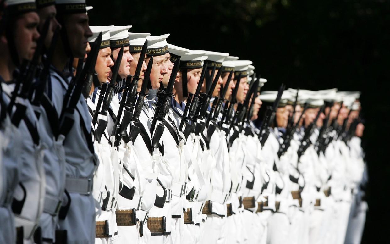 Members of the Royal New Zealand Navy line up at a ceremony - Getty Images AsiaPac